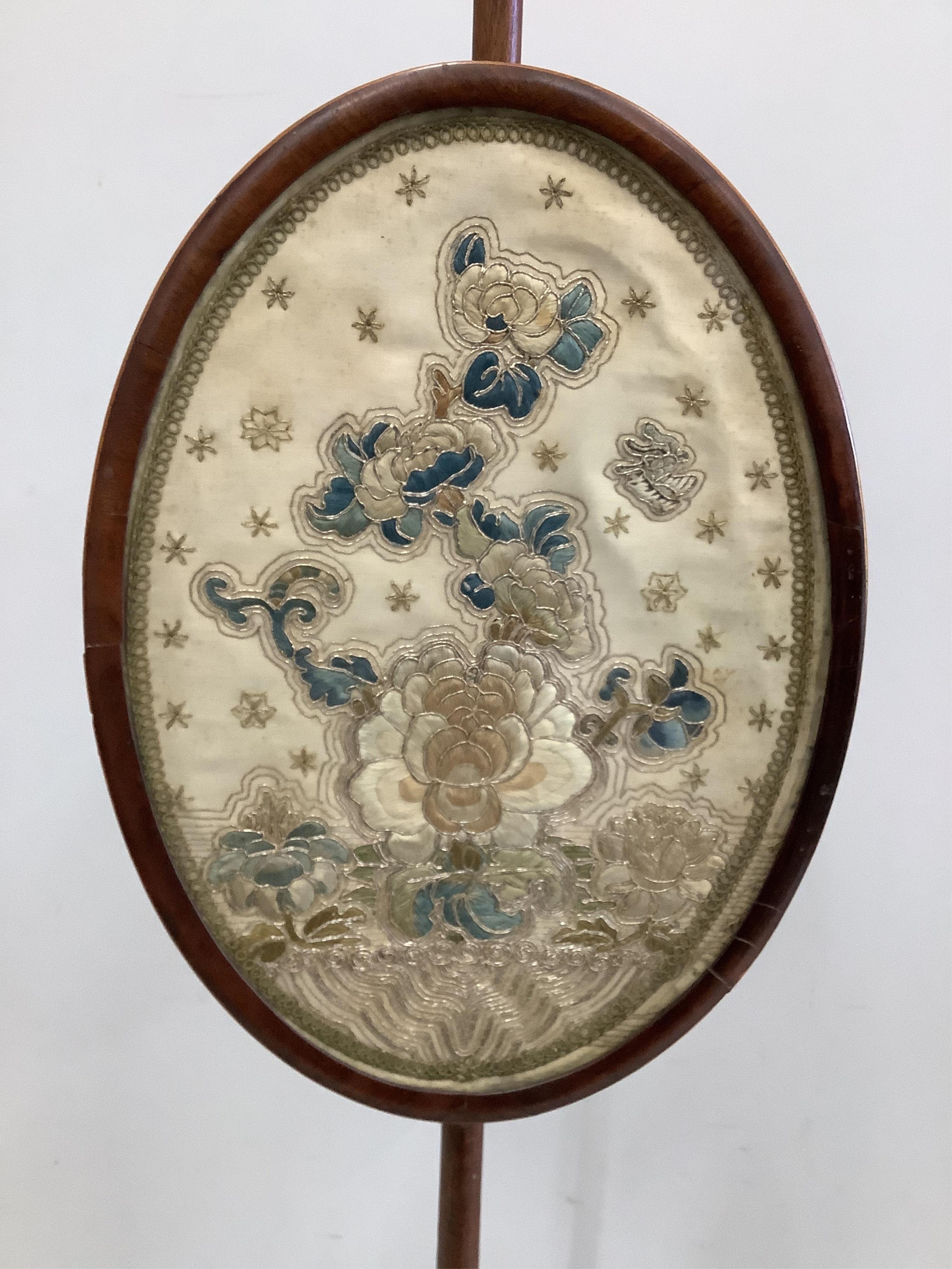 An early 19th mahogany pole screen, the banner inset with Chinese silk embroidery, height 163cm